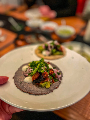 Close-up of Papa Pastor showing achiote, chili and pineapple spice