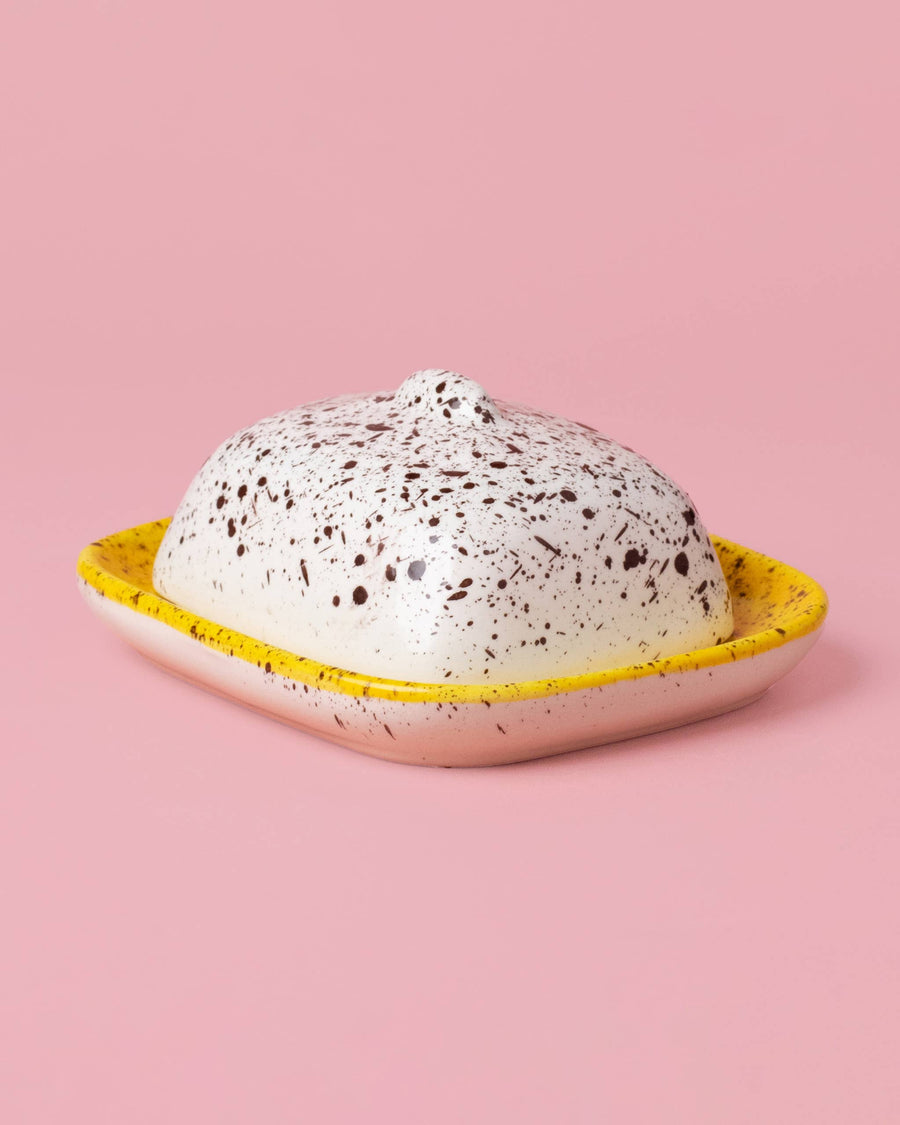 Ceramic butter plate with butter and knife lifestyle