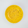 Handmade ceramic grater plate medium in use with ginger